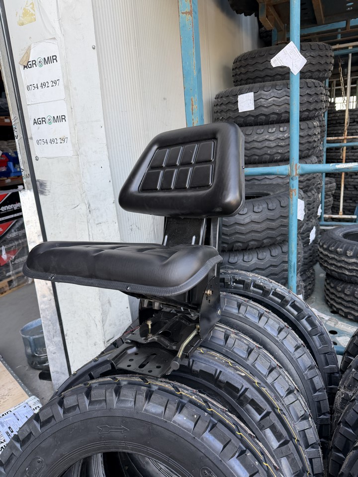 Scaun universal negru cu reglaj triplu si amortizor pentru tractor U-445 - imagine 6